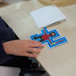 Zbliżenie na jedną z prac - świętego Mikołaja z mieczem świetlnym